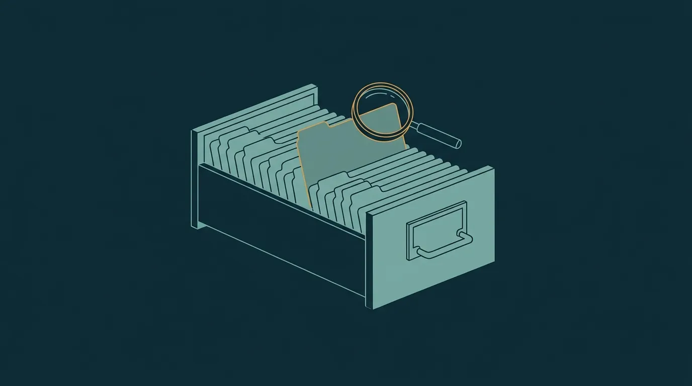 An open card-index drawer of blank tabbed cards, one lifted under a loupe: the hub of guides that explain each metric